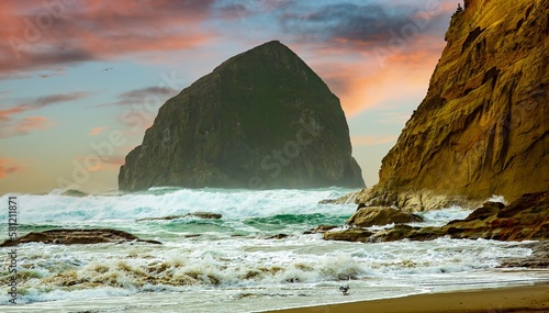 Fotografia Heavy surf crashing on the Haystack rock and the beach at Pacific City on the Or