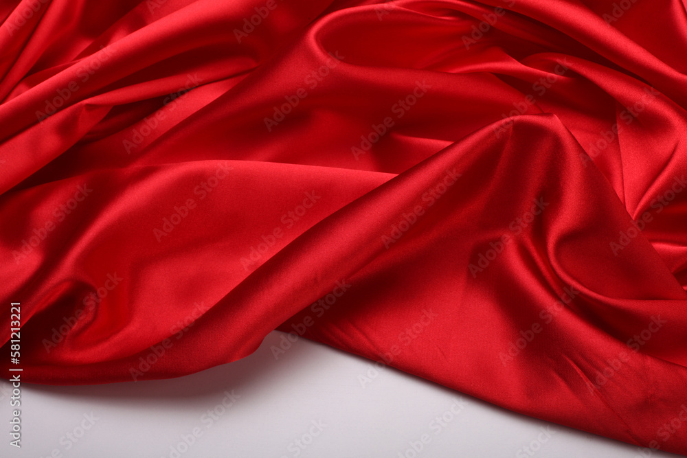 Red nacre wave fabric silk. Abstract texture horizontal copy space background. Red nacre wave fabric silk. Abstract texture horizontal copy space background.