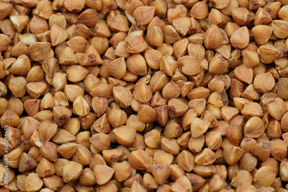 Buckwheat Groats Dry Uncooked Raw Natural Fresh Brown. Roasted buckwheat kernels. Healthy organic food. Background. Buckwheat Groats Dry Uncooked Raw Natural Fresh Brown. Roasted buckwheat kernels. Healthy organic food. Background.
