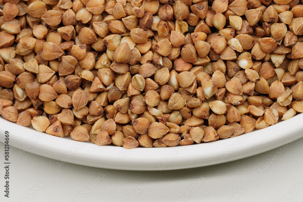 Buckwheat Groats Dry Uncooked Raw Natural Fresh Brown. Roasted buckwheat kernels. Healthy organic food. Background. Buckwheat Groats Dry Uncooked Raw Natural Fresh Brown. Roasted buckwheat kernels. Healthy organic food. Background.
