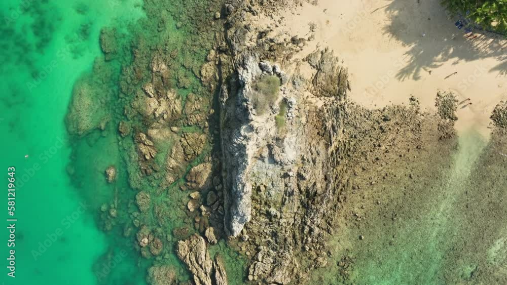 .aerial top view above small island in front of Yanui beach in low tide..when the water recedes, it becomes a beach..creative nature and travel concept. .aerial top view above small island in front of Yanui beach in low tide..when the water recedes, it becomes a beach..creative nature and travel concept.