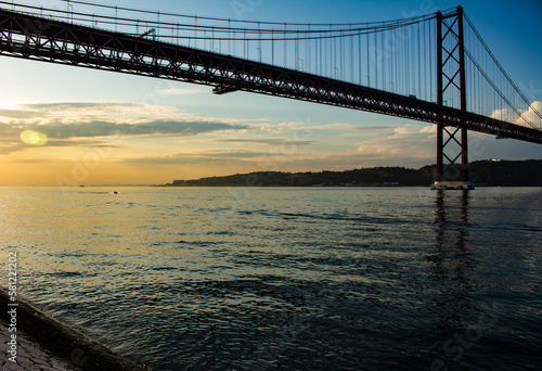 Suspension bridge in the city of Lisbon. Huge metal structure