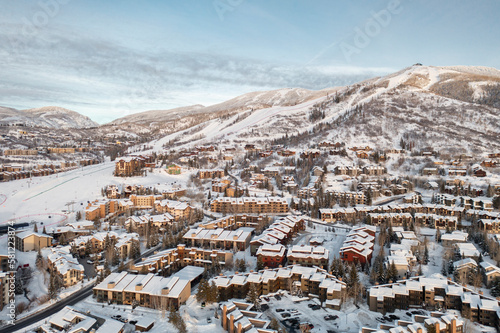 Panorama view of Steamboat Springs, Colorado mountain skiing and snowboarding resort town with Mt. Werner landscape in background  