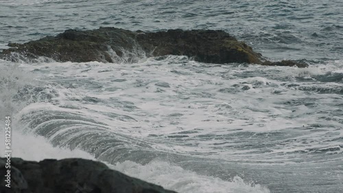 Rocky shore in the ocean. photo