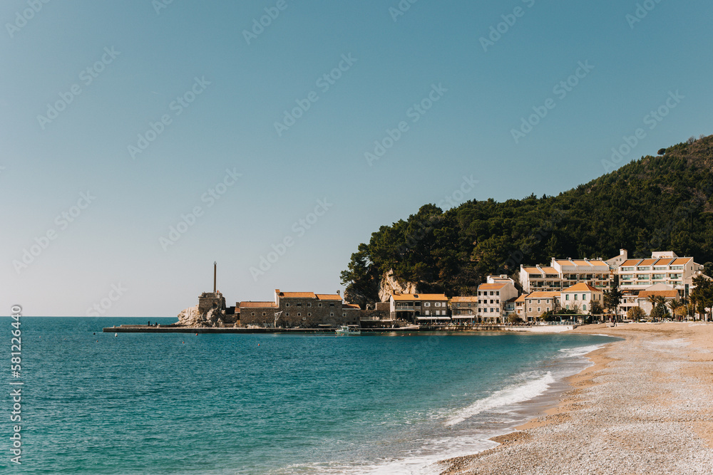 Amazing view of Petrovac town and the sea in a sunny day. Travel destination in Montenegro.