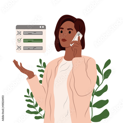 The manager talks to the client during a phone conversation, checking the list of tasks. Black woman talking on the phone at work in the office.
