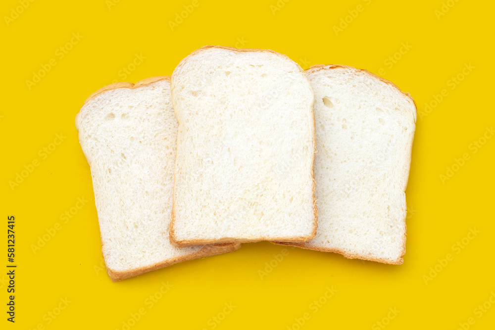 Sliced bread on yellow background.