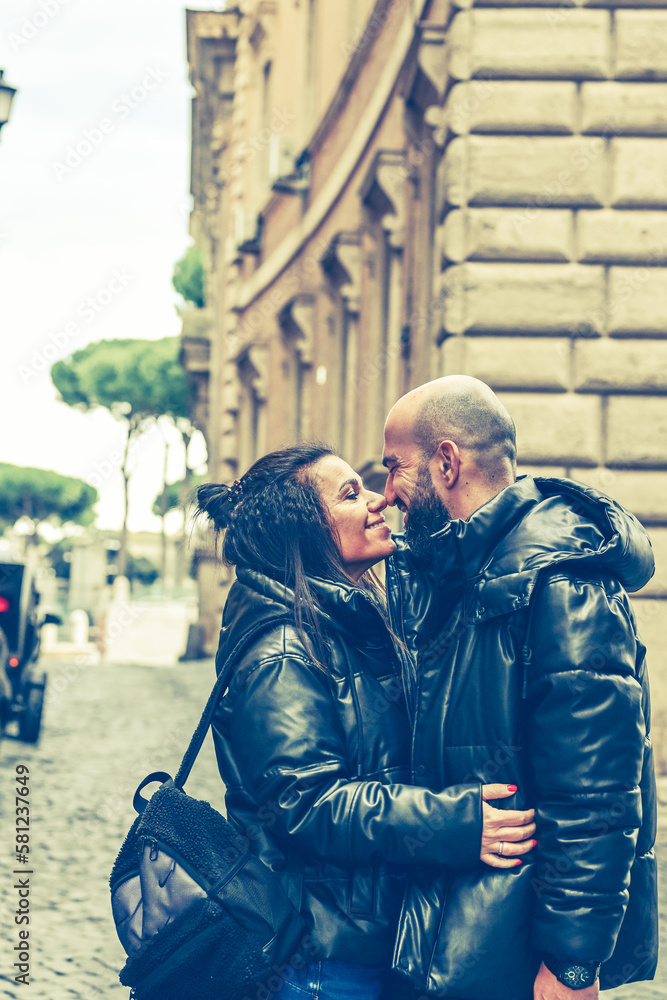 Happy  Tourists  couple traveling at Rome, Italy,   Hugging  on the streets of , Rome, Italy Concept of Italian travel. 
