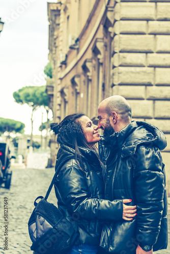 Happy Tourists couple traveling at Rome, Italy, Hugging on the streets of , Rome, Italy Concept of Italian travel. 