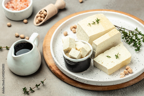 soy cheese tofu diced on a light background, Healthy vegan meatless meal rich in protein and calcium. Food recipe background. Close up photo