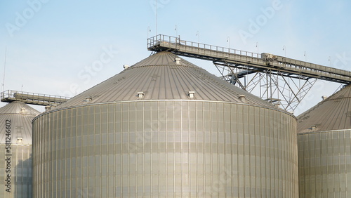 Grain storage. Grain storage elevator. Large metal hangar for grain. Silo with grain