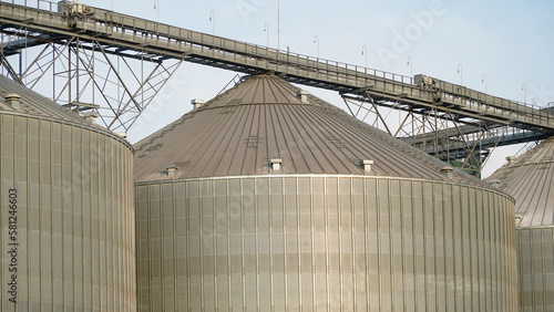 Grain storage. Grain storage elevator. Large metal hangar for grain. Silo with grain