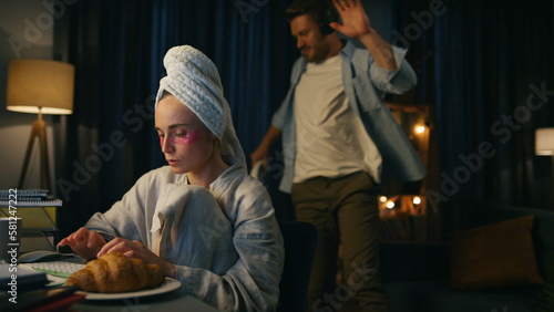 Busy woman working distantly at dark flat closeup. Focused freelancer texting