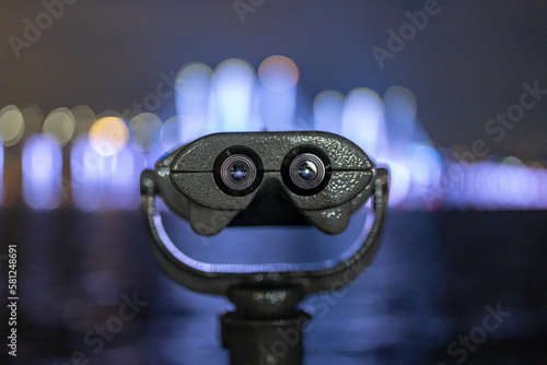 Tarrytown, NY - USA - February 2, 2023: Binoculars at Tarrytown Overlook with the Governor Mario M. Cuomo Bridge and Hudson River in the background.