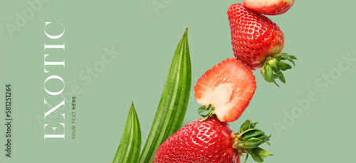 Fototapeta Naklejka Na Ścianę i Meble -  Creative concept of strawberry on the green background.  Exotic fruits and leaves. Food concept.