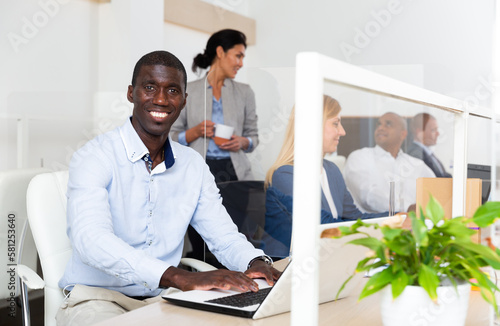 african male happy businessman in white room photo