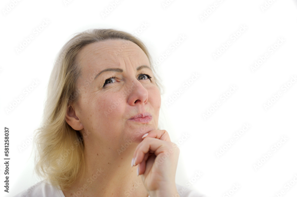 Pretty portrait of young beautiful woman and adult thinking looking left and smiling a bit having a finger at her lips, isolated on white background High quality photo Pretty portrait of young beautiful woman and adult thinking looking left and smiling a bit having a finger at her lips, isolated on white background High quality photo