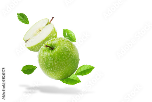 Water splashing on Fresh green apple on Green background