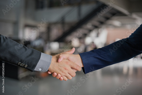 Group of business people meeting shaking hands together, business outdoor meeting concept.