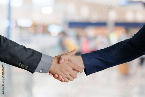 Group of business people meeting shaking hands together, business outdoor meeting concept.