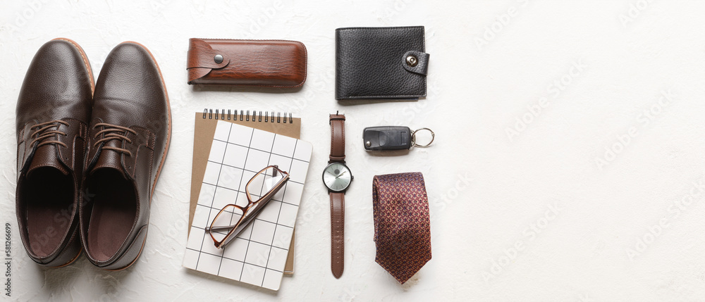 Set of stylish male accessories with notebooks on light background with space for text Set of stylish male accessories with notebooks on light background with space for text