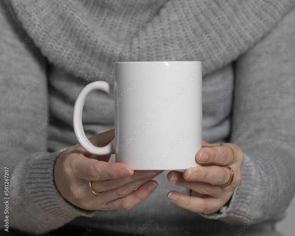 Girl in a sweater holding white coffee mug 11 oz, white porcelain mug mock up 