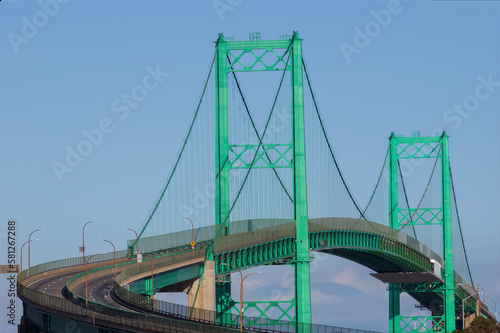 The Vincent Thomas Bridge in San Pedro, California shown in the afternoon on a sunny day.