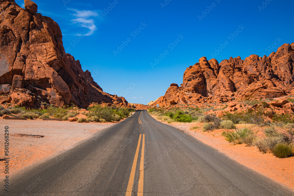 Deserted Desert Road with Sandstone Rock formations Deserted Desert Road with Sandstone Rock formations