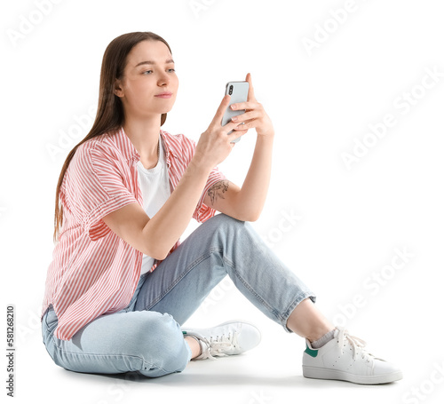 Sitting young woman with sm...