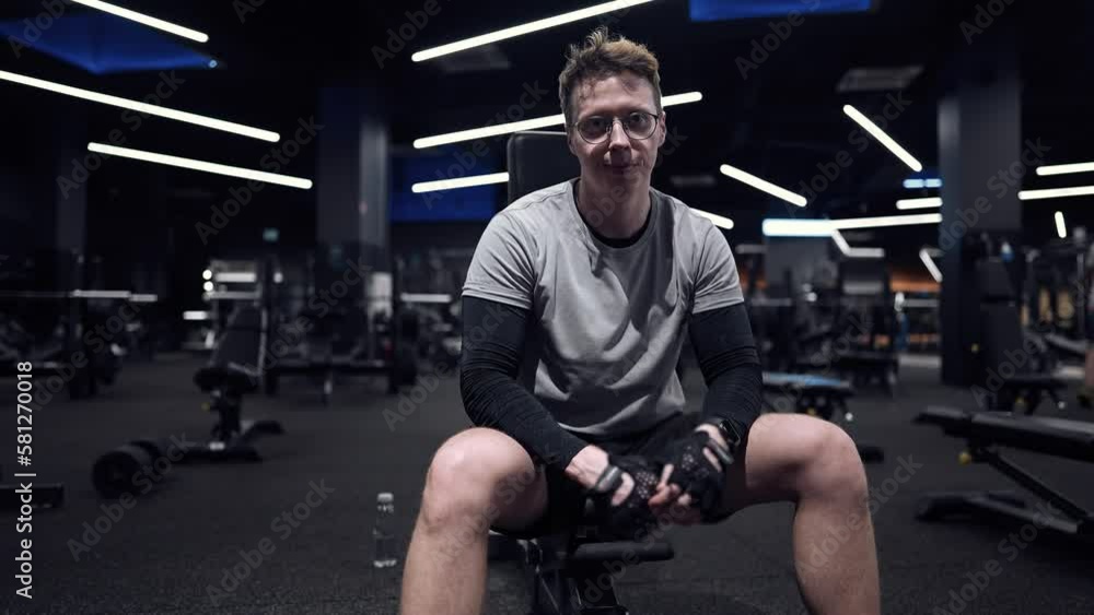 Fitness man trains with dumbbells in a modern gym, arm training
slow motion Fitness man trains with dumbbells in a modern gym, arm training
slow motion