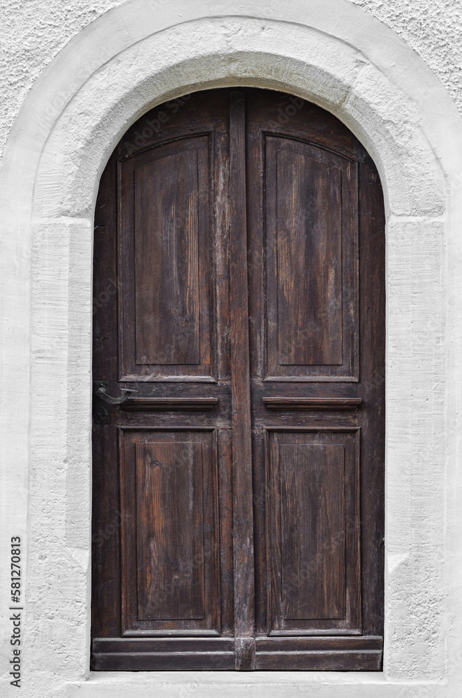 View of white building with dark wooden door View of white building with dark wooden door