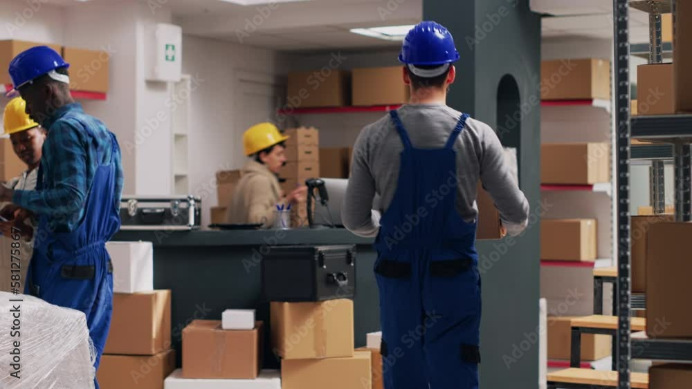 Timelapse of employees group checking boxes on racks, working in cargo warehouse with merchandise to do stock logistics. Diverse people arranging delivery packs, fast foward time lapse. Timelapse of employees group checking boxes on racks, working in cargo warehouse with merchandise to do stock logistics. Diverse people arranging delivery packs, fast foward time lapse.