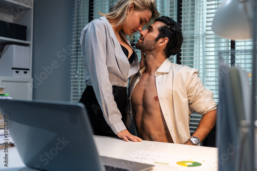 Canvas-taulu Caucasian businessman and woman foreplay and making love in the office
