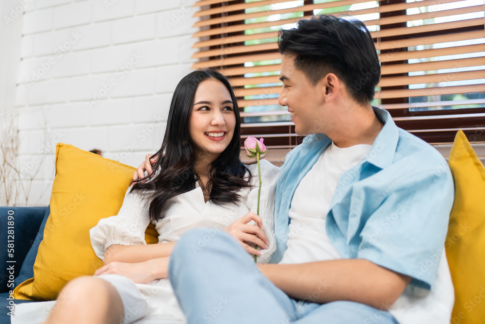 Asian young man surprise and give rose flower to beautiful girlfriend. Asian young man surprise and give rose flower to beautiful girlfriend.