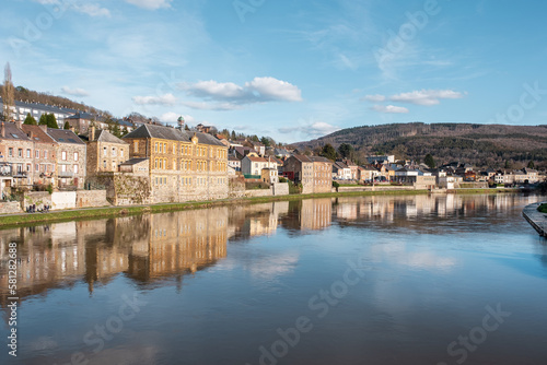  The beautiful village of Monthermé lies in the heart of the Ardennes department in France, view from the bridge over the awesome river Meuse. © remi