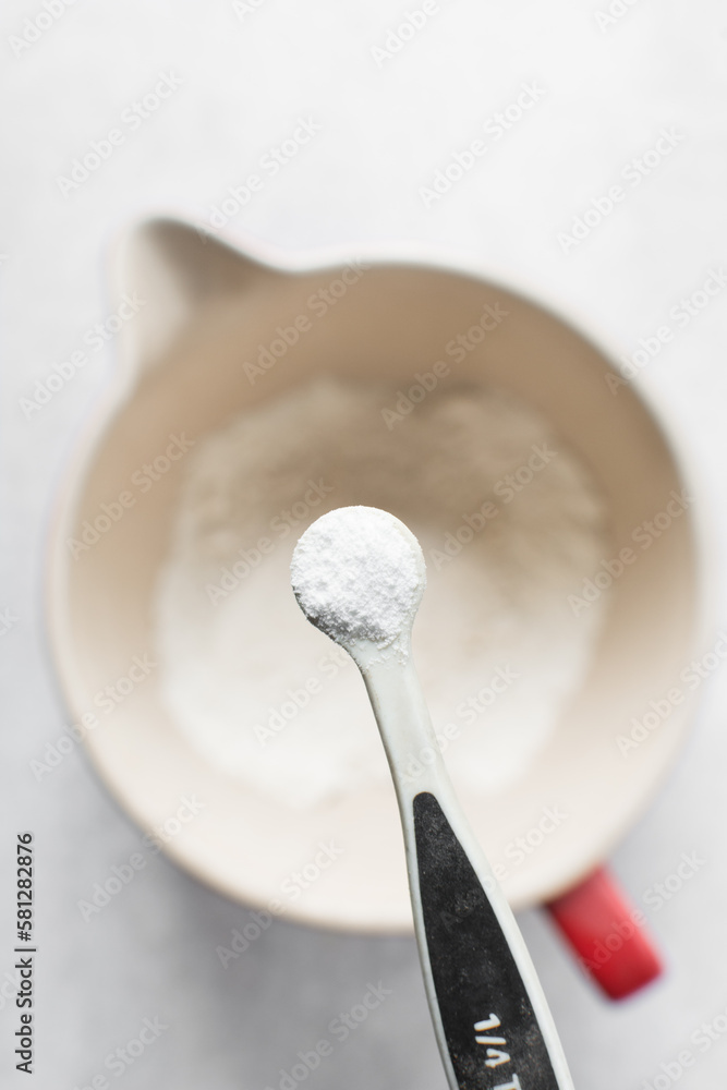 A teaspoon of baking soda or baking powder A teaspoon of baking soda or baking powder