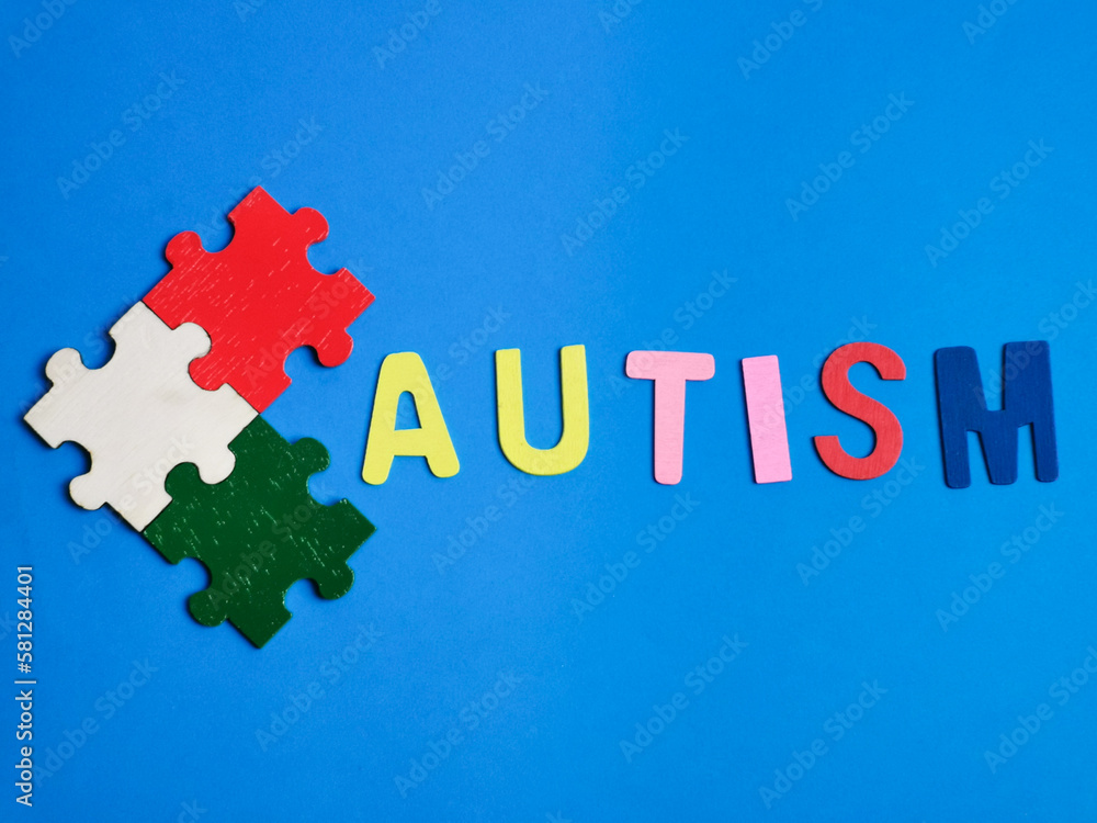 Autism awareness concept with jigsaw puzzles on blue background. Autism awareness concept with jigsaw puzzles on blue background.