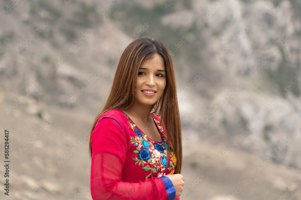 A Pakistani woman tourist travel in Karakoram high mountain hills. Nature landscape background, Skardu-Gilgit, Pakistan. Travel on holiday vacation. People lifestyle. A Pakistani woman tourist travel in Karakoram high mountain hills. Nature landscape background, Skardu-Gilgit, Pakistan. Travel on holiday vacation. People lifestyle.