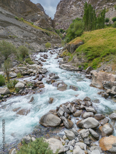 Aerial top view of Mantoka Waterfall in Karakoram high mountain hills. Nature landscape background, Skardu-Gilgit, Pakistan. Travel on holiday vacation. photo