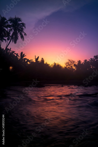 Early morning landscape. Beautiful sunrise with river and trees in silhouette