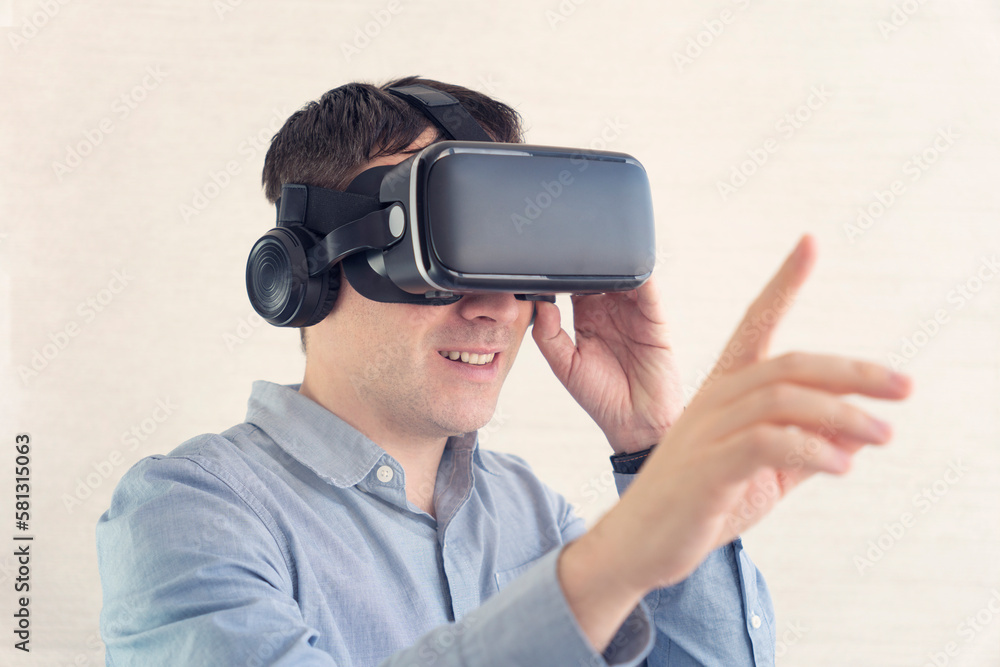 Realistic 3d visualization, innovative business technology. augmented reality. Businessman using virtual reality glasses in office. Man in VR headset standing touching objects in digital simulation. Realistic 3d visualization, innovative business technology. augmented reality. Businessman using virtual reality glasses in office. Man in VR headset standing touching objects in digital simulation.