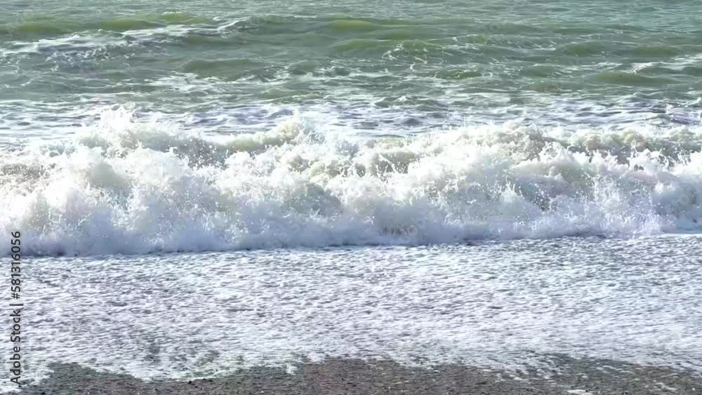 Powerful sea waves are crashing on the Black Sea coast. Waves splash on the beach with pebbles during a storm. Storm at sea. Panoramic view of the Black Sea. Russia. Sunset on the beach. 4K Powerful sea waves are crashing on the Black Sea coast. Waves splash on the beach with pebbles during a storm. Storm at sea. Panoramic view of the Black Sea. Russia. Sunset on the beach. 4K