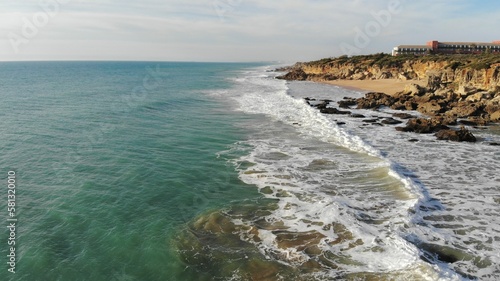 Empty sea coast with sandy beach, watching a California shore drone aerial