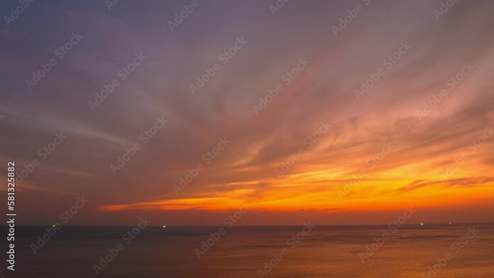 aerial hyper lapse view exotic red sky in sunset at Karon beach Phuket..Scene of colorful romantic sky sunset with changing the brilliant yellow sky gradually turned red. .4k video travel concept.. aerial hyper lapse view exotic red sky in sunset at Karon beach Phuket..Scene of colorful romantic sky sunset with changing the brilliant yellow sky gradually turned red. .4k video travel concept..
