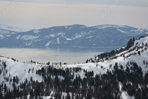 Lake Tahoe as seen from the top of Tamarack Peak near Incline Village, Nevada. Sierra Nevada mountains and snow in the background.
