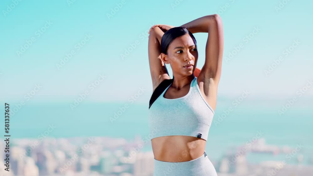 Fitness, Indian woman stretching arm muscles and outdoor running workout with blue sky for health and wellness. Sports mockup, motivation and healthy mindset, training and stretch for marathon runner Fitness, Indian woman stretching arm muscles and outdoor running workout with blue sky for health and wellness. Sports mockup, motivation and healthy mindset, training and stretch for marathon runner