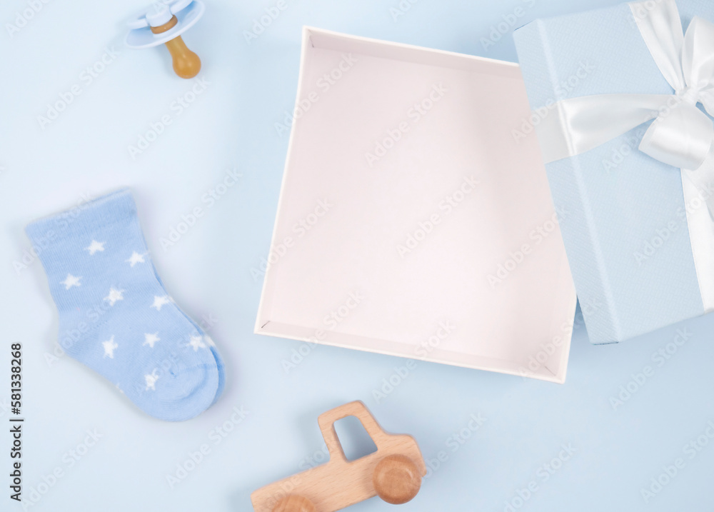 A box with a toy bow and other accessories on a blue background. A box with a toy bow and other accessories on a blue background.