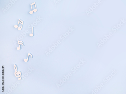 White notes on a blue background. Concept melody, music, song.