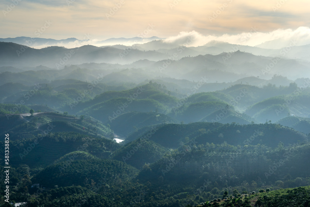 Fanciful scenery of an early morning when the sun rises over the Dai Lao mountain range, Bao Loc district, Lam Dong province, Vietnam