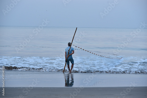 fisher man on the beach 